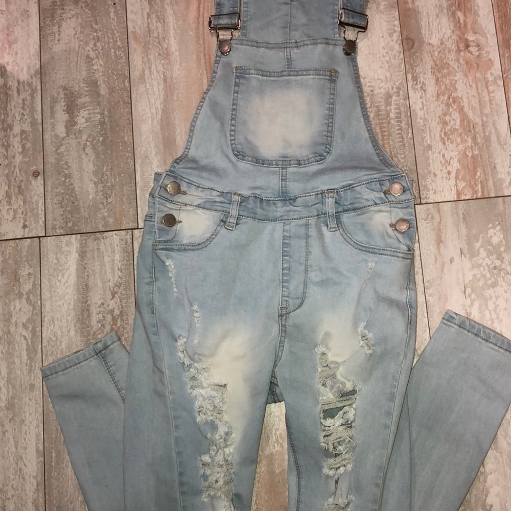 light blue ripped denim jean overalls